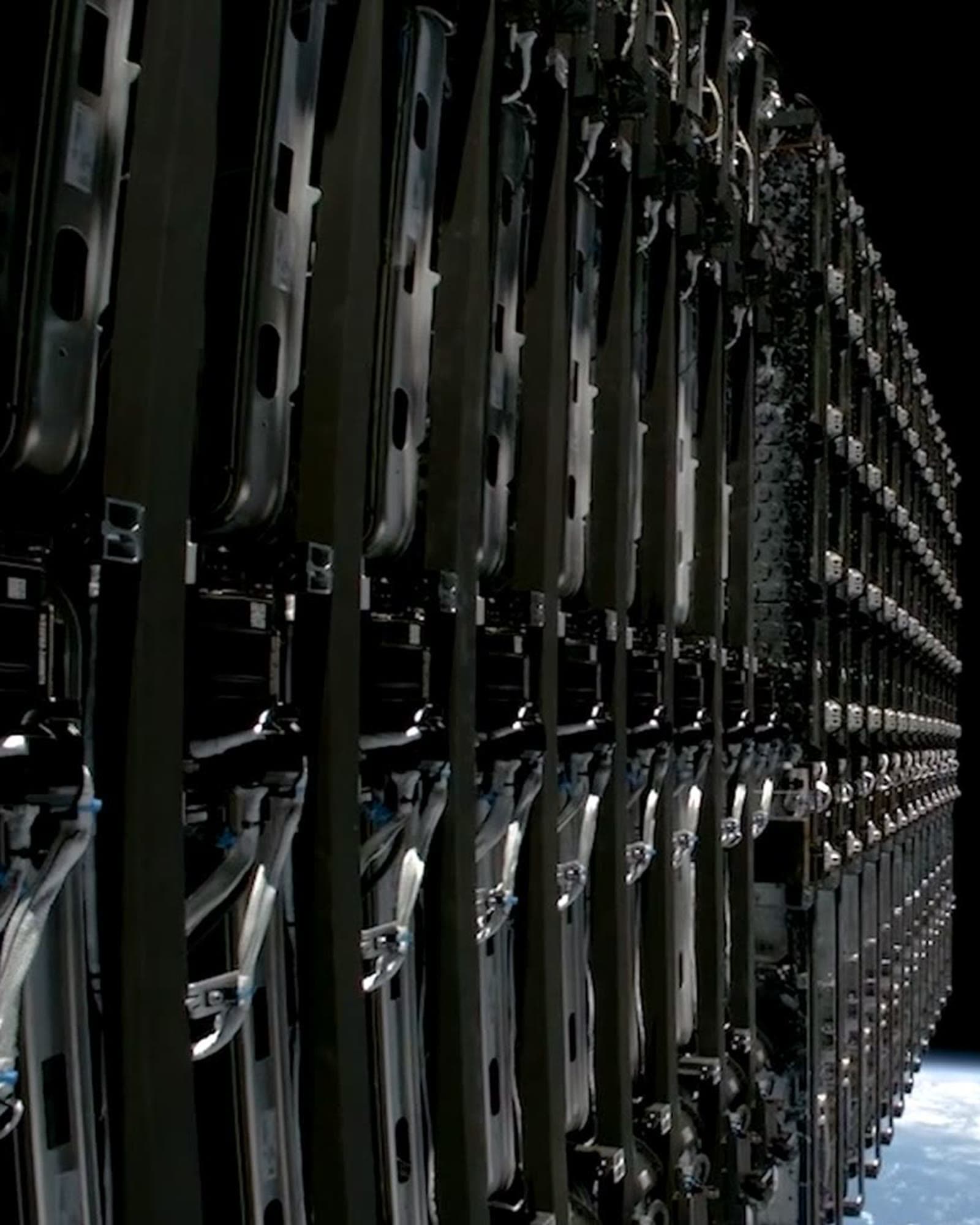 A train of Starlink satellites deploying in orbit above Earth.