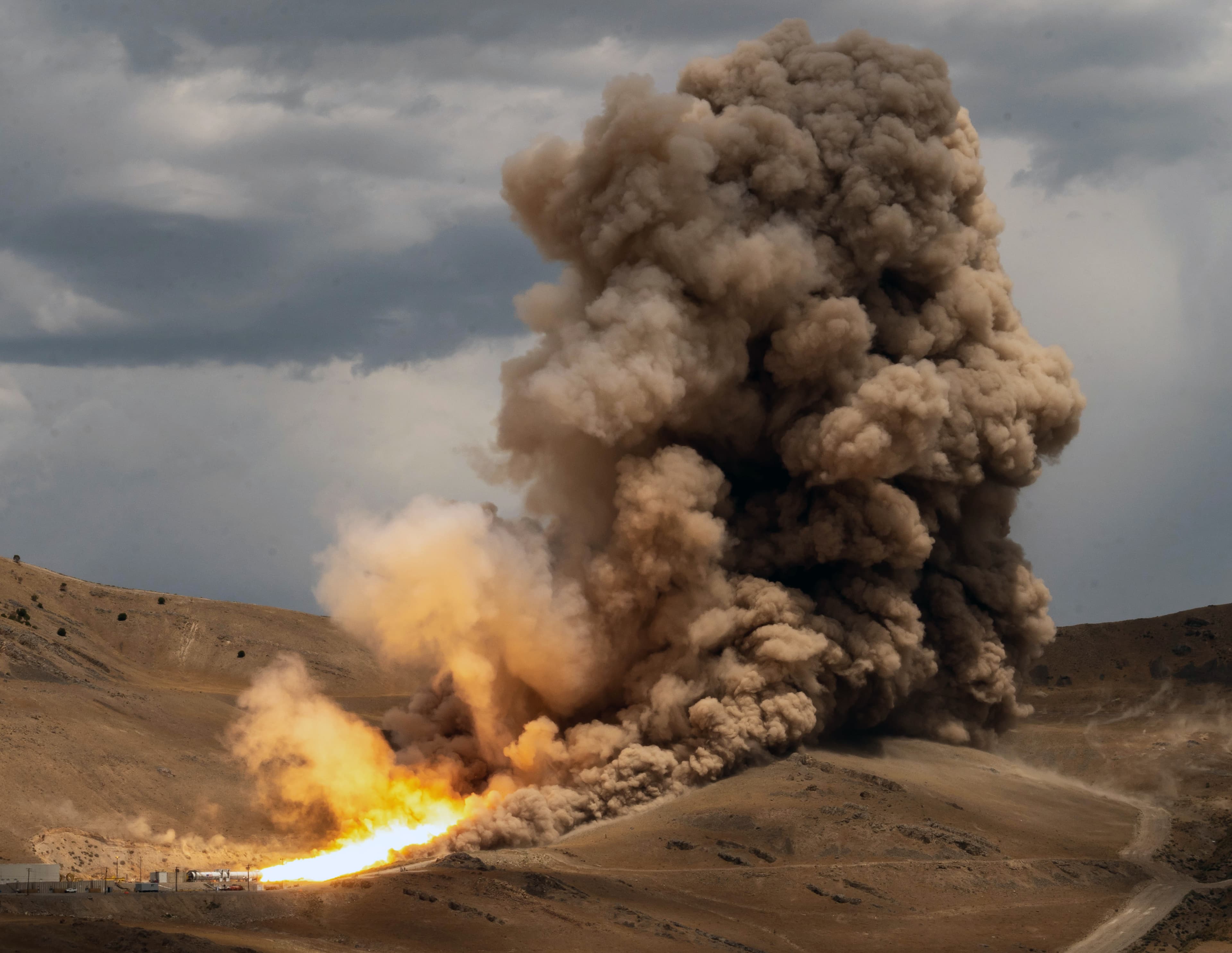NASA and Northrop Grumman conducting a large solid rocket booster test.