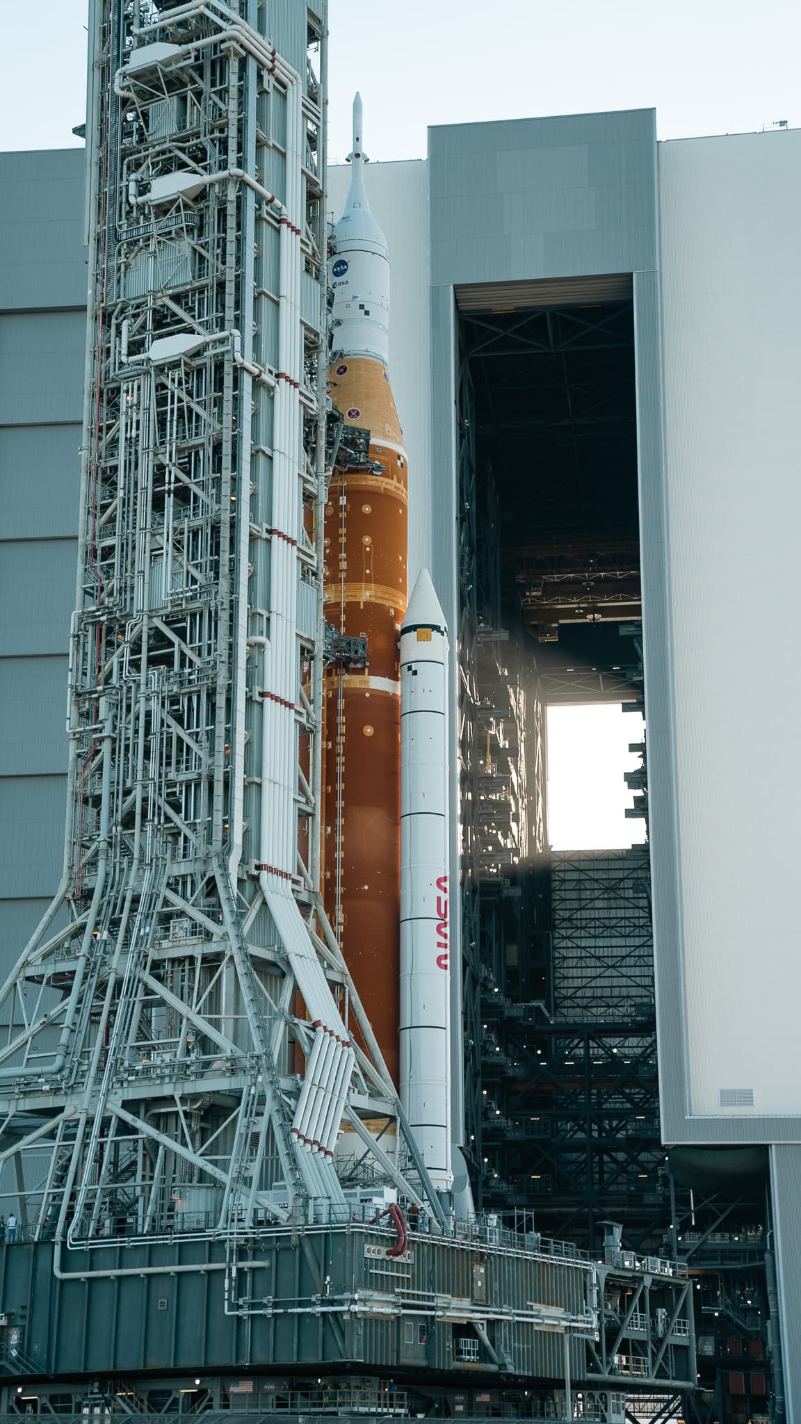 NASA's Space Launch System rocket and Orion spacecraft on Kennedy Space Center launch infrastructure.